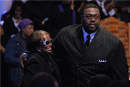 Bishop Neal Roberson greets Evangelist Dorothy Norwood after singing