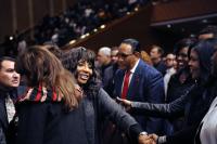 Sandra Crouch greeted by CeCe Winans and Reba Rambo as Bobby Jones looks on