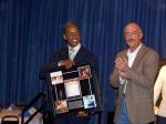 Donald Lawrence receives his monumental award from Billboard