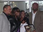 Kelly Price receives her nominations certificate