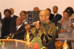 Pastor Bernard Jakes brings the services to order