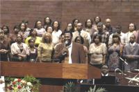 Percy Gray leads the choir in 