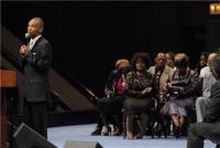 Shirley Caesar and Delois Washington listen as DeAndrae Patterson sings