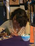 Pastor Brenda Jefferson signing CDs.